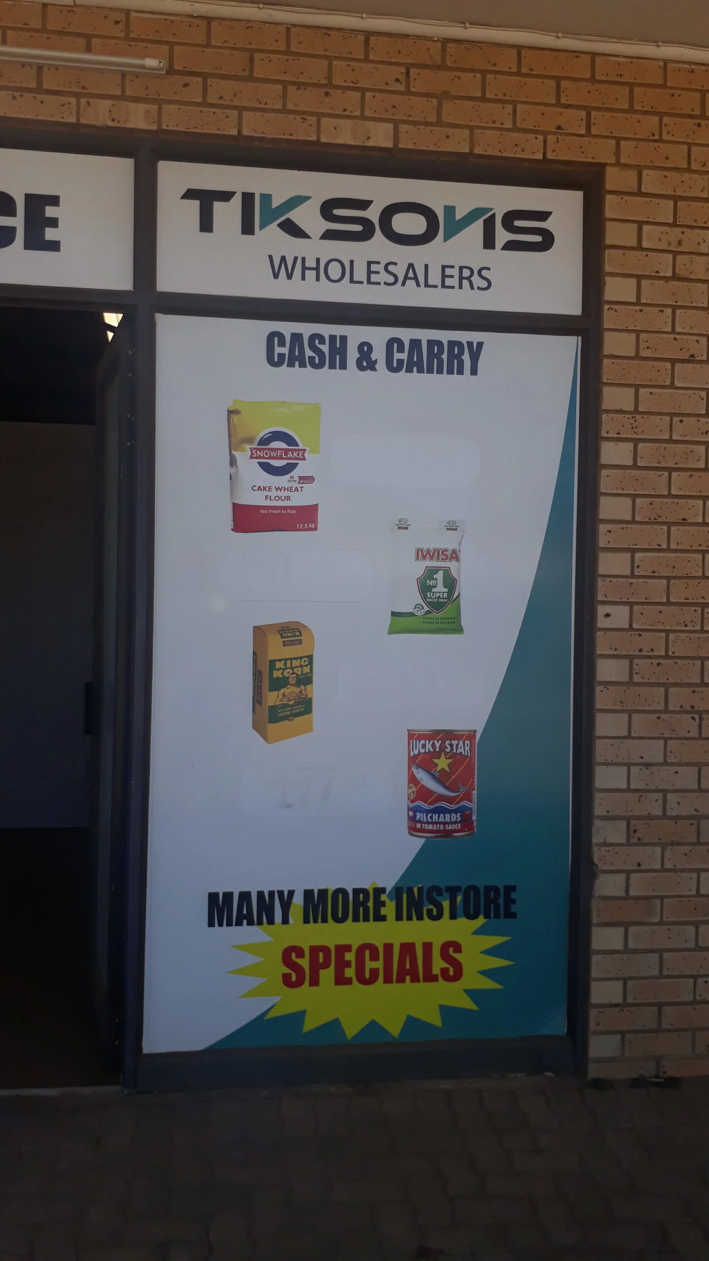 Tiksovis Wholesalers promotional window display sign