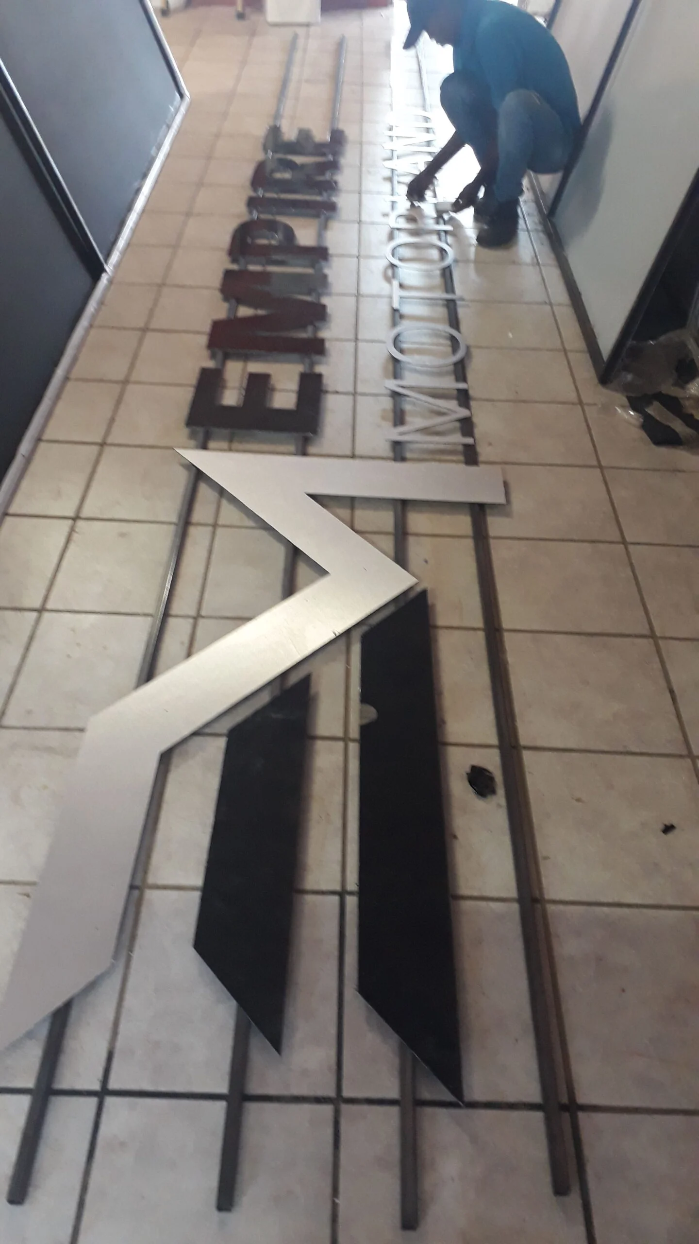 Empire Motors sign letters being fabricated